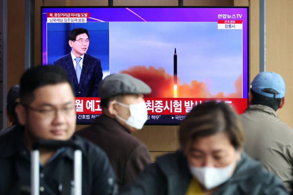 People watch a TV broadcasting a news report on North Korea firing a ballistic missile of intermediate range or longer, at a railway station in Seoul, South Korea, on 13th April, 2023.