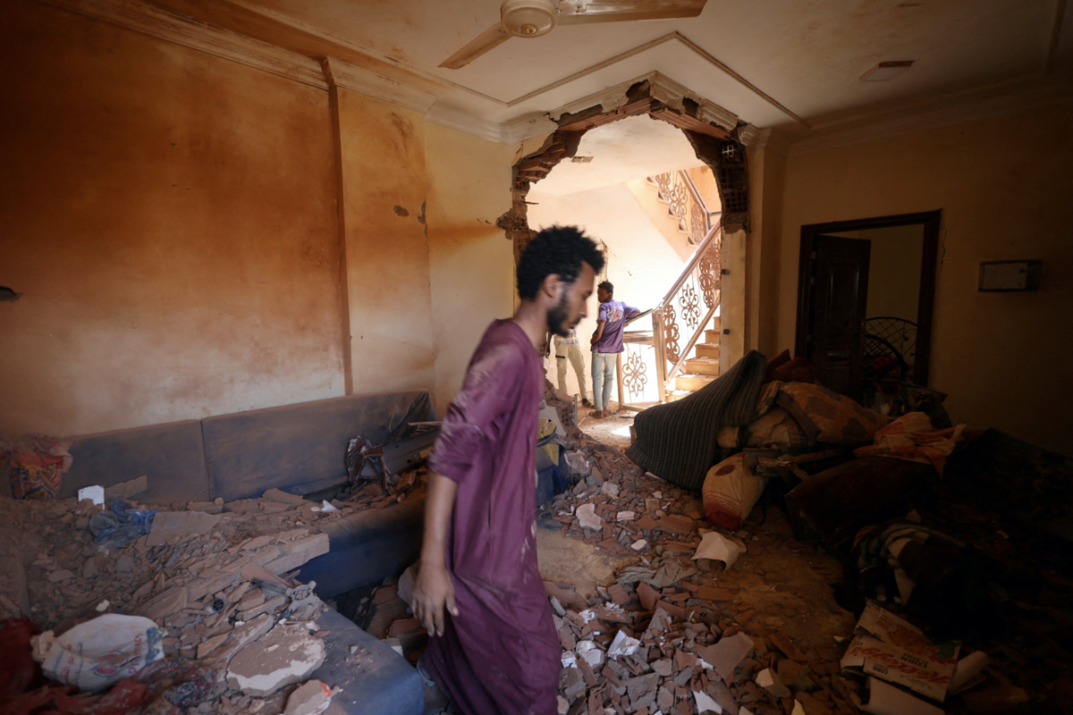 A man looks at the damage inside a house during clashes between the paramilitary Rapid Support Forces and the army in Khartoum, Sudan, on 17th April, 2023. 
