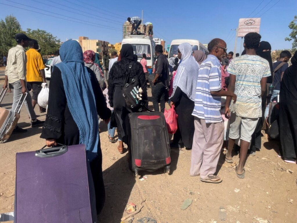 People gather at the station to flee from Khartoum during clashes between the paramilitary Rapid Support Forces and the army in Khartoum, Sudan, on 1 9th April, 2023.