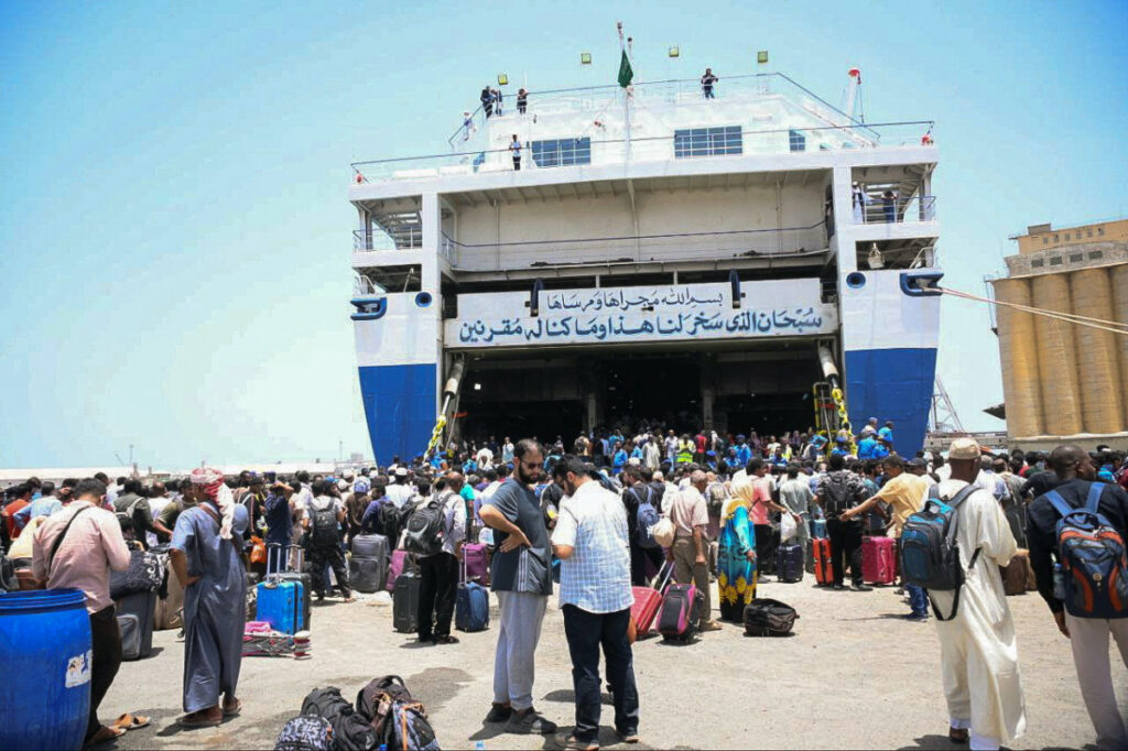 European, Asian and African nationals prepare to board a ship to Saudi Arabia, at Port Sudan, Sudan, on 28th April, 2023.