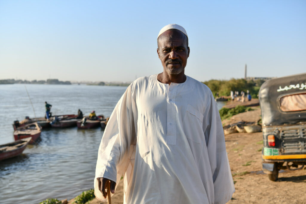 Al-Nimeiry Musa Mohammad, 45, a Sudanese fisherman who has been working on the Nile for twenty-five years, poses for a portrait by the Nile River bank in Omdurman, Sudan, on 11th February, 2023.