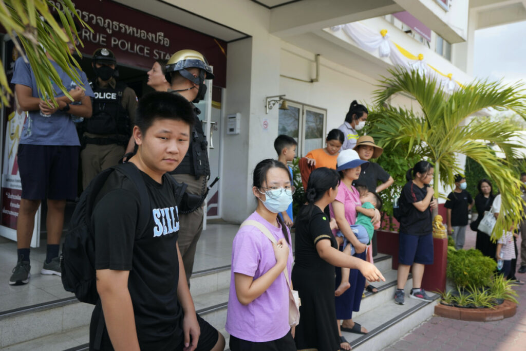 Members of the Shenzhen Holy Reformed Church, also known as the Mayflower Church, leave from the Nongprue police station on their way to Pattaya Provincial Court in Pattaya, Thailand, on 31st March, 2023