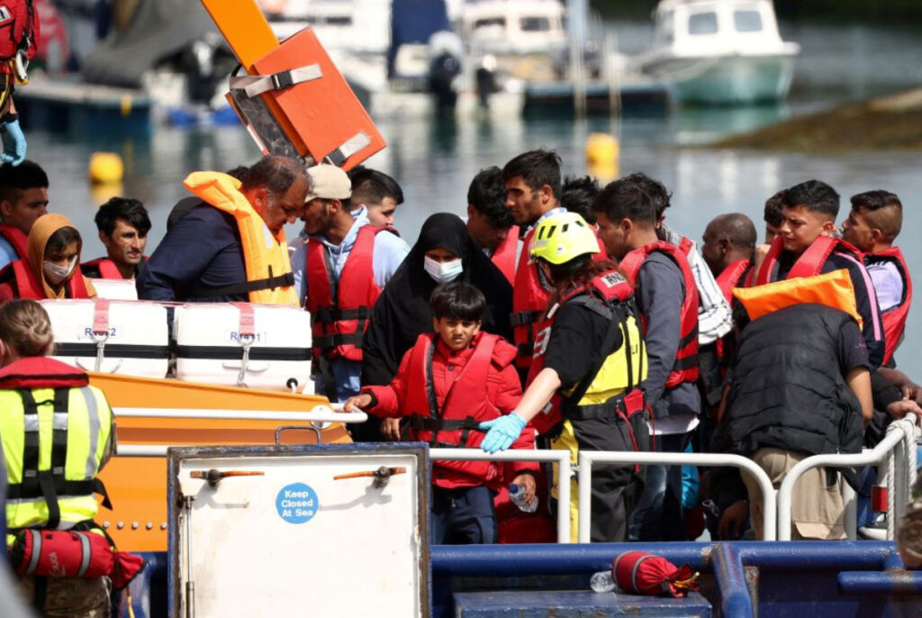 Migrants arrive at Dover harbour on board a Border Force vessel, after being rescued while attempting to cross the English Channel, in Dover, Britain, on 24th August, 2022.