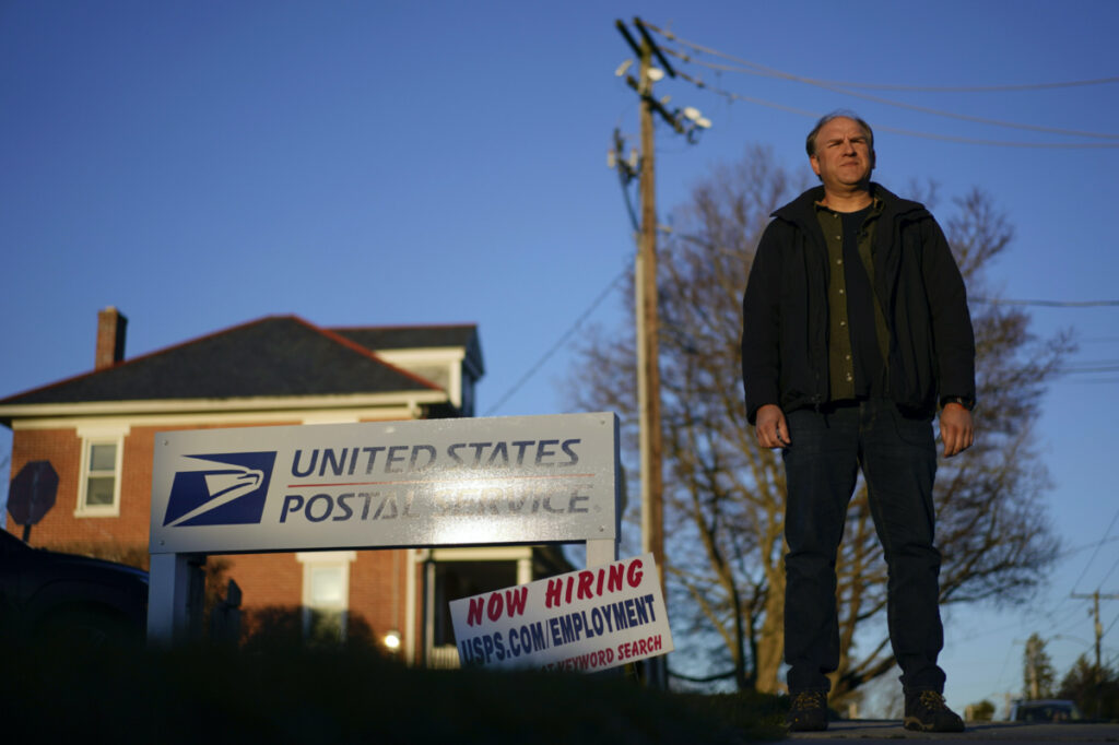 Gerald Groff, a former postal worker whose case will be argued before the Supreme Court, stands during a television interview near a "Now Hiring" sign posted at the roadside at the United State Postal Service, on Wednesday, 8th March, 2023, in Quarryville, Pennsylvania, US