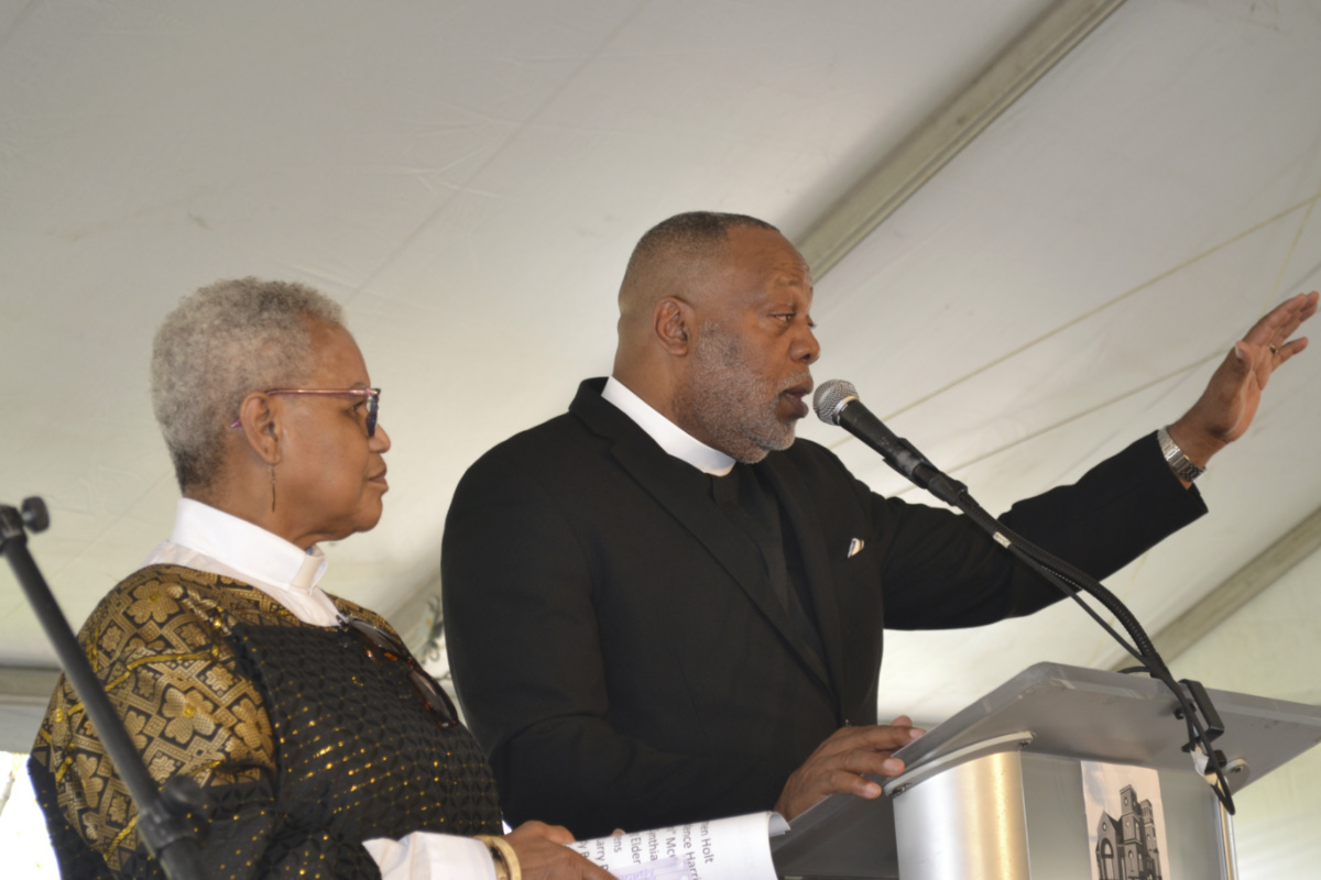 Rev Prudence Harris, left, an associate pastor of Bethel AME Church in Pittsburgh, listens as the Rev Dale Snyder, Bethel's pastor, speaks at a news conference Friday, 14th April, 2023, announcing an agreement with the Pittsburgh Penguins