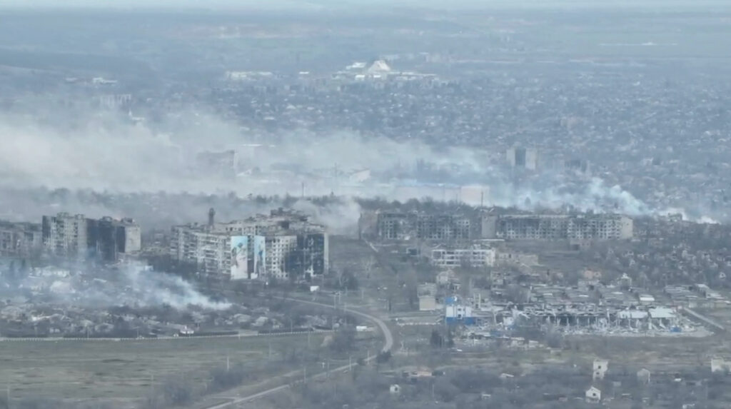 An aerial view shows smoke billowing, in Bakhmut, Ukraine, in still image taken from an undated video obtained from social media