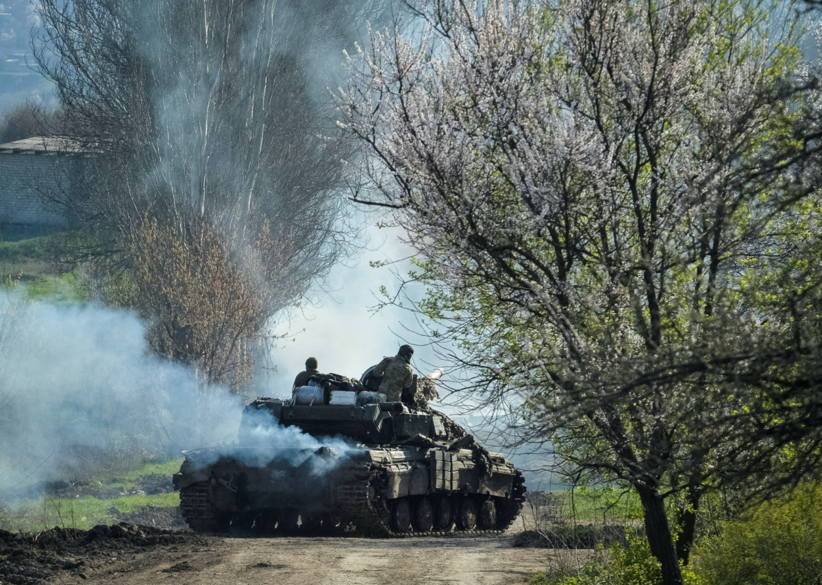 Ukrainian service members ride a tank, as Russia's attack on Ukraine continues, near the front line city of Bakhmut, Ukraine, on 10th April, 2023.