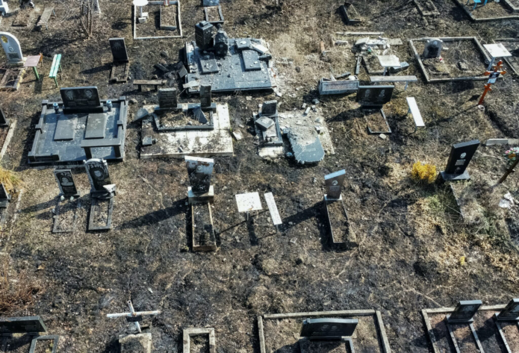 A view shows graves damaged by a Russian military strikes, amid Russia's attack on Ukraine, at a cemetery in Kharkiv, Ukraine, on 28th March, 2023.