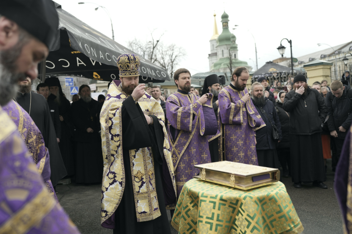 Priests of Ukrainian Orthodox Church pray with their supporters after resisting a government order to leave the Kyiv Pechersk Lavra monastery complex in Kyiv, Ukraine, Saturday, on 1st April, 2023. 