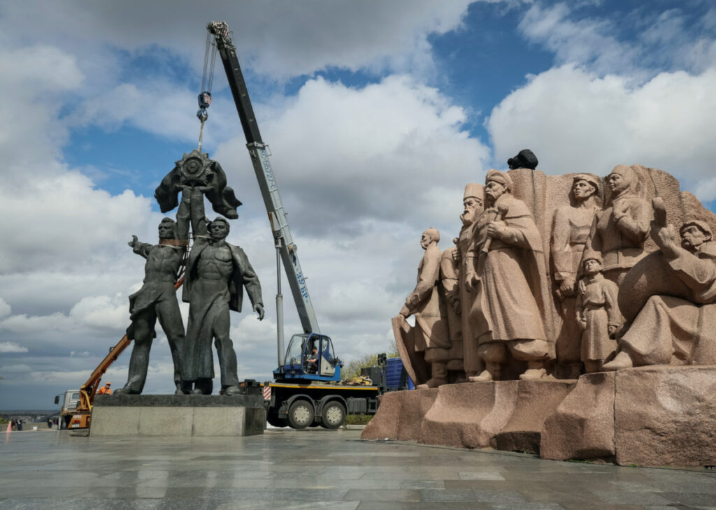 A Soviet monument to a friendship between Ukrainian and Russian nations is seen during its demolition, in central Kyiv, Ukraine, on 26th April, 2022.