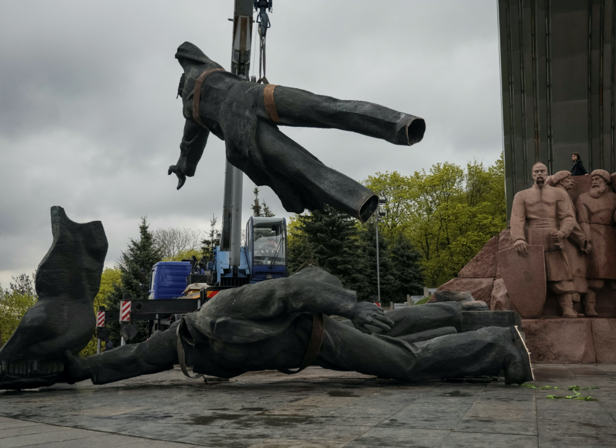 A Soviet monument to a friendship between Ukrainian and Russian nations is seen during its demolition, in central Kyiv, Ukraine, on 26th April, 2022. 
