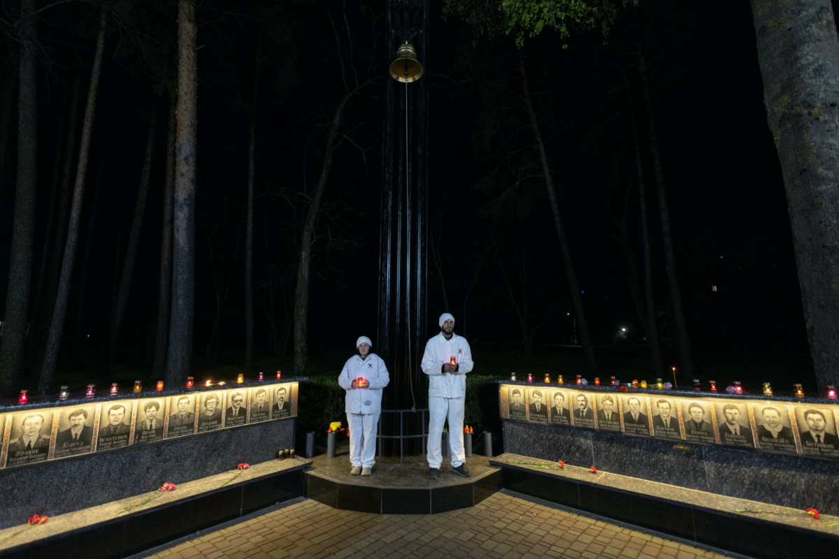 Staff of the Chornobyl nuclear plant hold candles at a memorial dedicated to firefighters and workers who died after the Chornobyl nuclear disaster, during a night commemorative service, amid Russia’s attack on Ukraine, in Slavutych, Ukraine, on 26th April, 2023. 