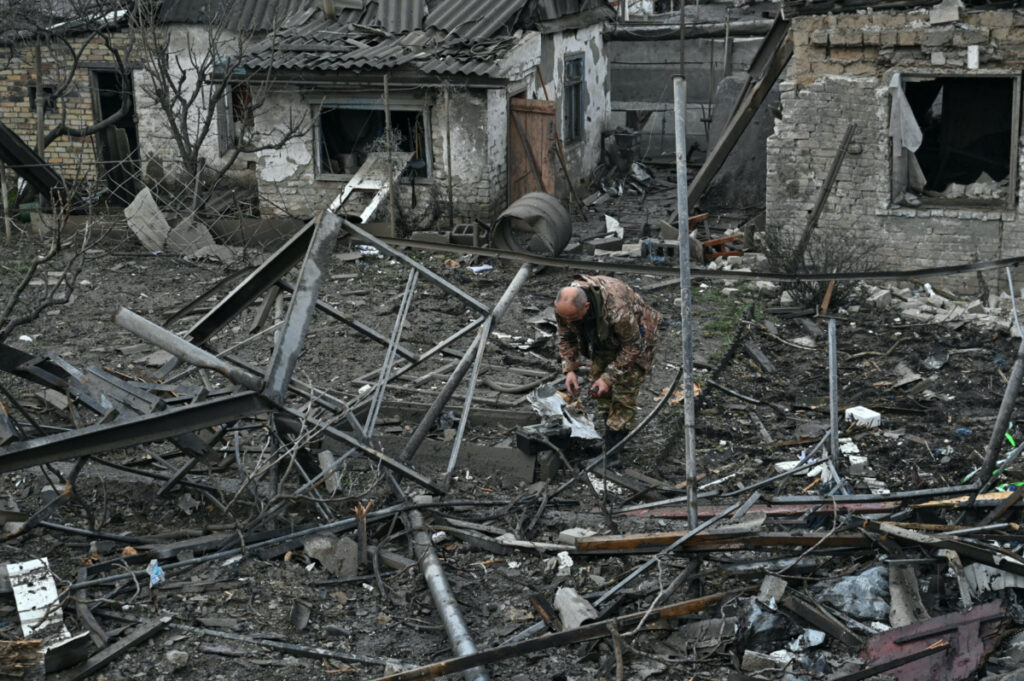 A police officer inspects remains of a Russian missile which hit a residential area, amid Russia's attack on Ukraine, in Zaporizhzhia, Ukraine, on 9th April, 2023.