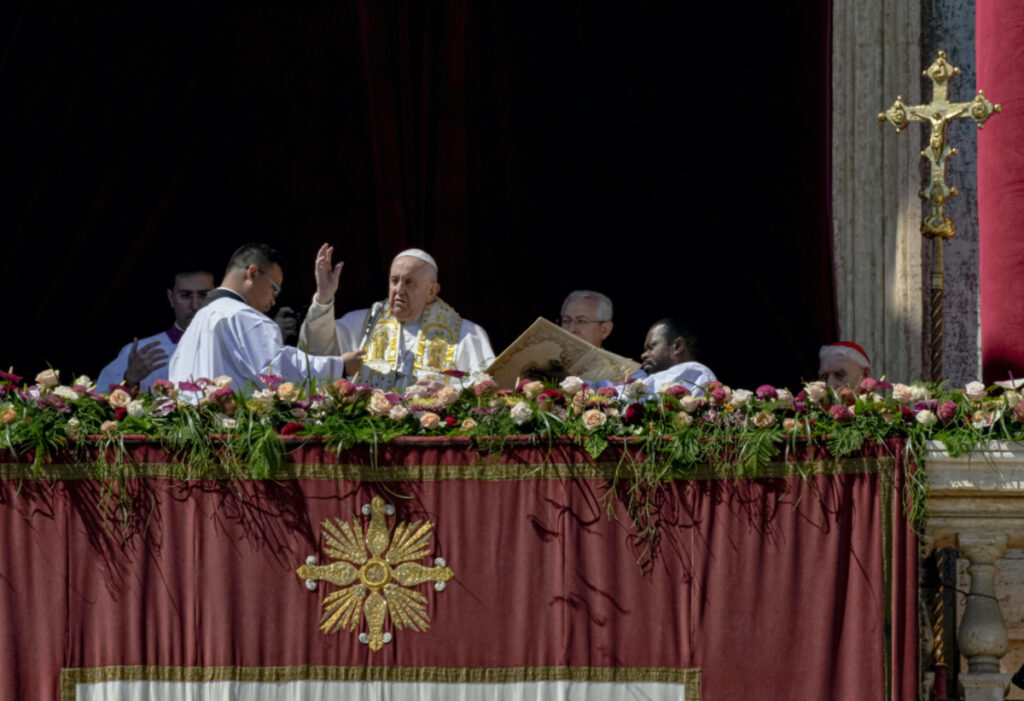 Pope Francis bestows the plenary 'Urbi et Orbi' blessing from the central lodge of the St Peter's Basilica at The Vatican at the end of the Easter Sunday mass, Sunday, on 9th April, 2023.
