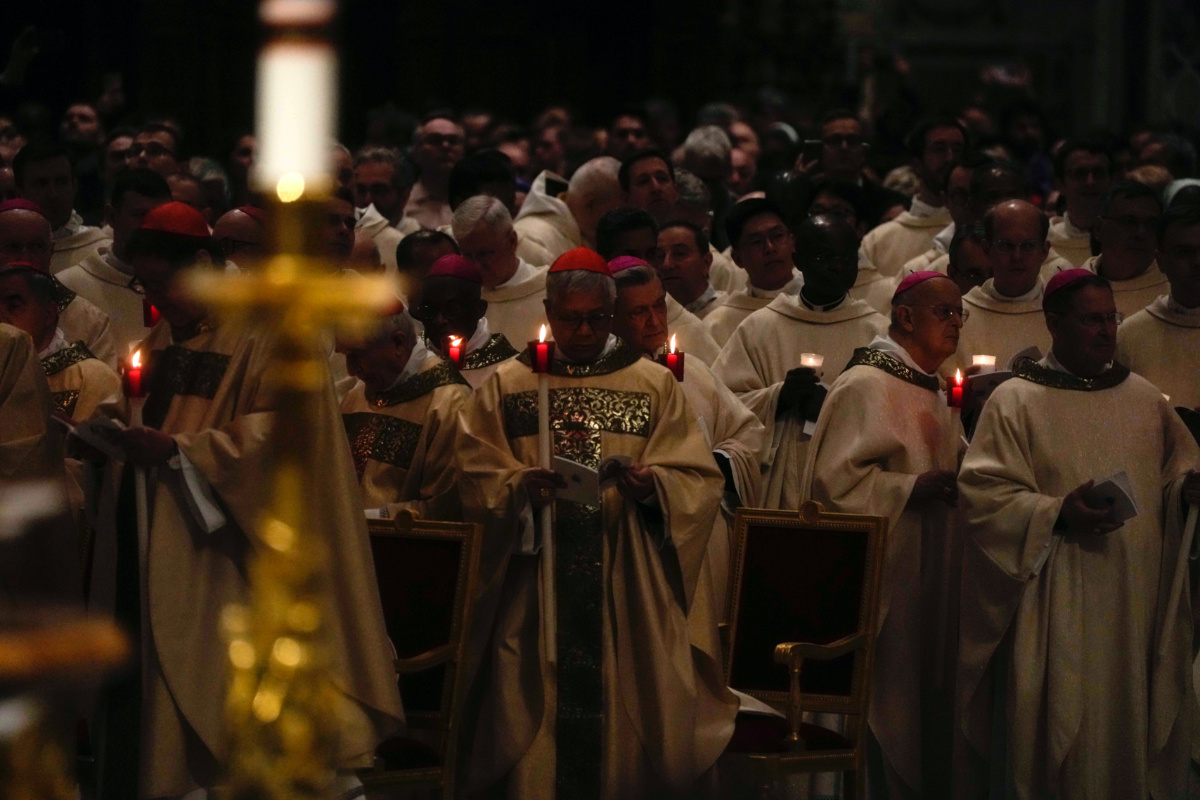 Cardinals hold candles as Pope Francis presides over an Easter vigil ceremony in St. Peter's Basilica at the Vatican, on Saturday, 8th April, 2023.