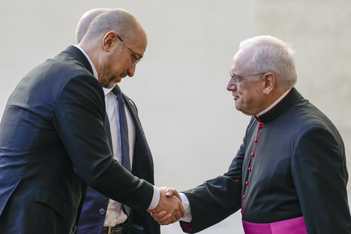 Ukraine Prime Minister Denys Shmyhal, left, is welcomed by the Head of Papal Household Monsignor Leonardo Sapienza as he arrives at the Vatican, on Thursday, 27th April, 2023, for an audience with Pope Francis.