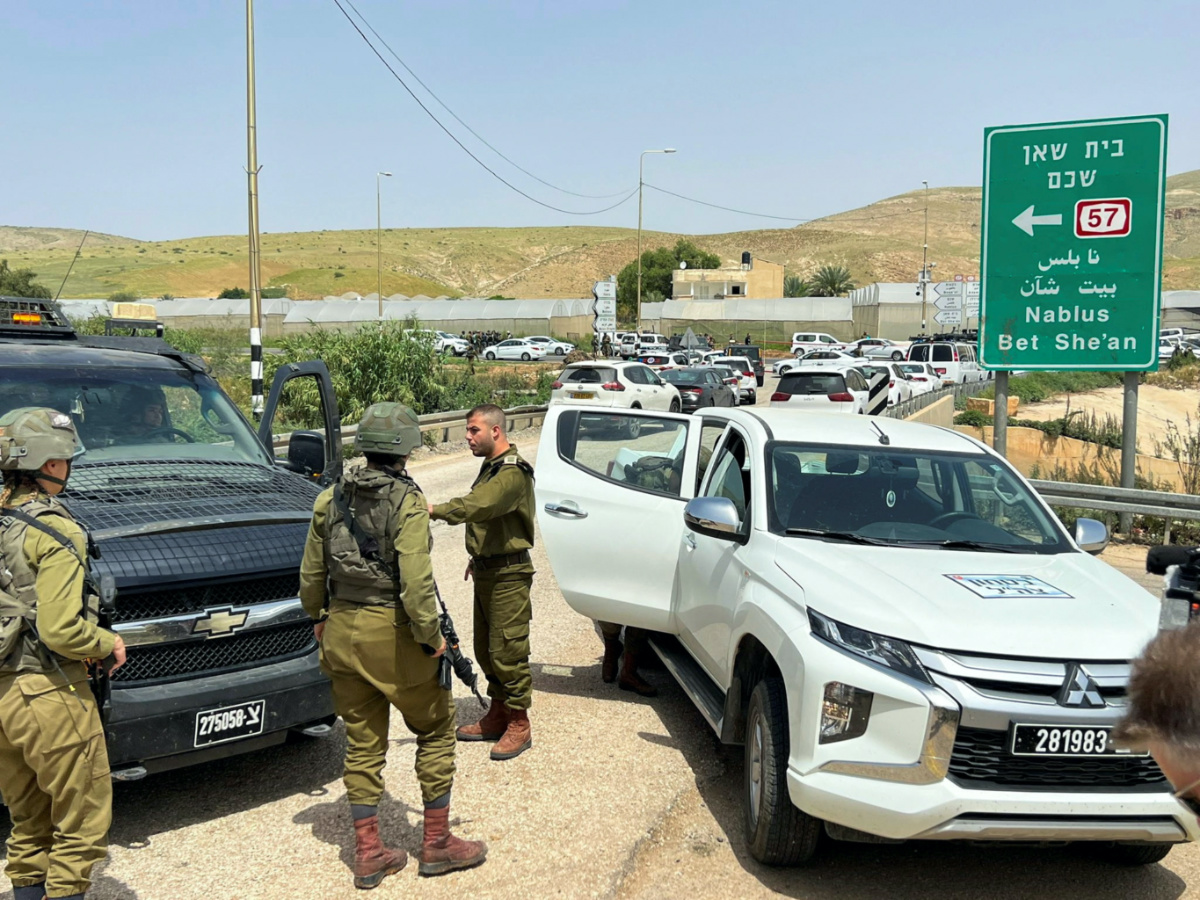 Israeli troops stand guard at a shooting attack scene, in the Jordan Valley in the Israeli-occupied West Bank on 7th April, 2023. 