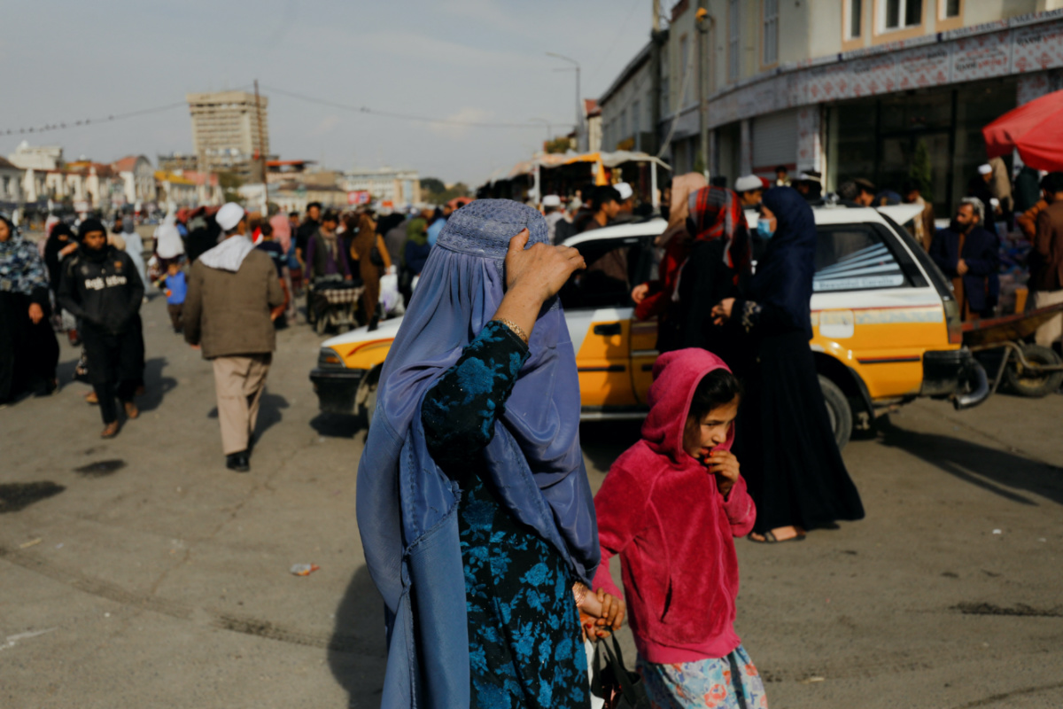An Afghan woman and a girl walk in a street in Kabul, Afghanistan, on 9th November, 2022. 
