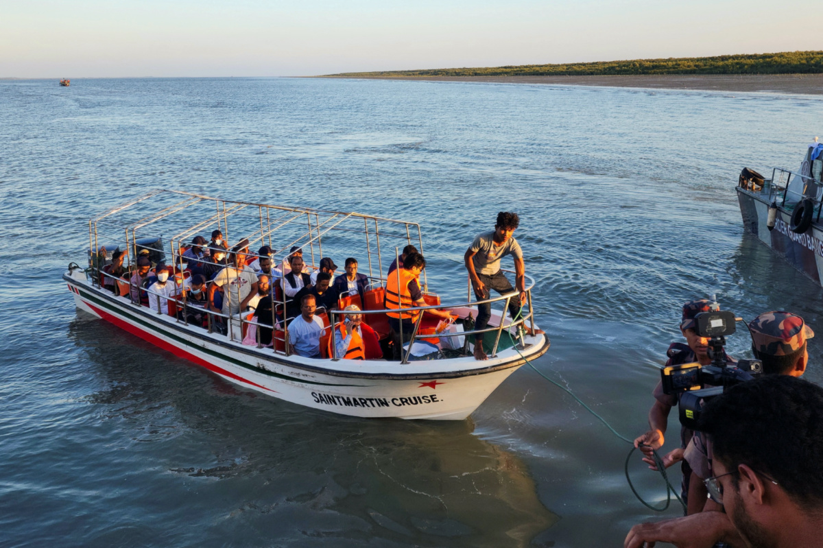 Some Rohingya Muslim refugees and Bangladeshi officials on a boat return after visiting Myanmar's Rakhine State as part of an effort to encourage their voluntary repatriation, in Teknaf, Cox's Bazar, Bangladesh, on 5th May, 2023