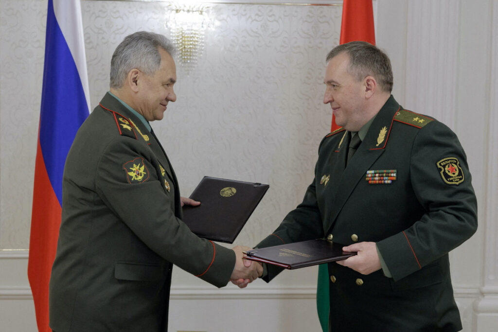Russian Defence Minister Sergei Shoigu shakes hands with Belarusian Defence Minister Victor Khrenin during a meeting in Minsk, Belarus, on 25th May, 2023.