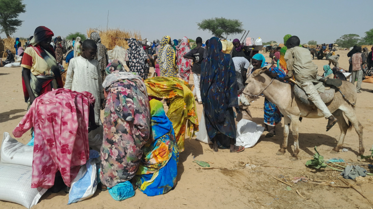 Sudanese refugees who fled the violence in their country, gather for food given by the World Food Programme near the border between Sudan and Chad, in Koufroun, Chad, on 28th April, 2023