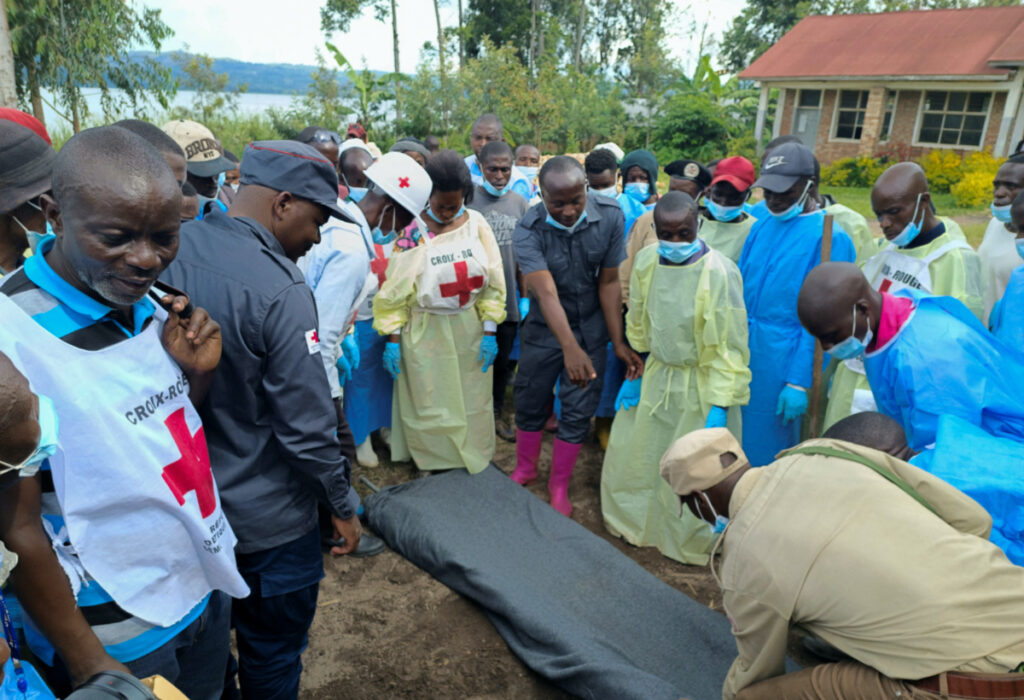 Red Cross workers and volunteers gather for a briefing where Congolese civilians were killed following rains that destroyed the remote, mountainous area and ripped through the riverside villages of Nyamukubi, Kalehe territory in South Kivu province of the Democratic Republic of Congo on 9th May, 2023.