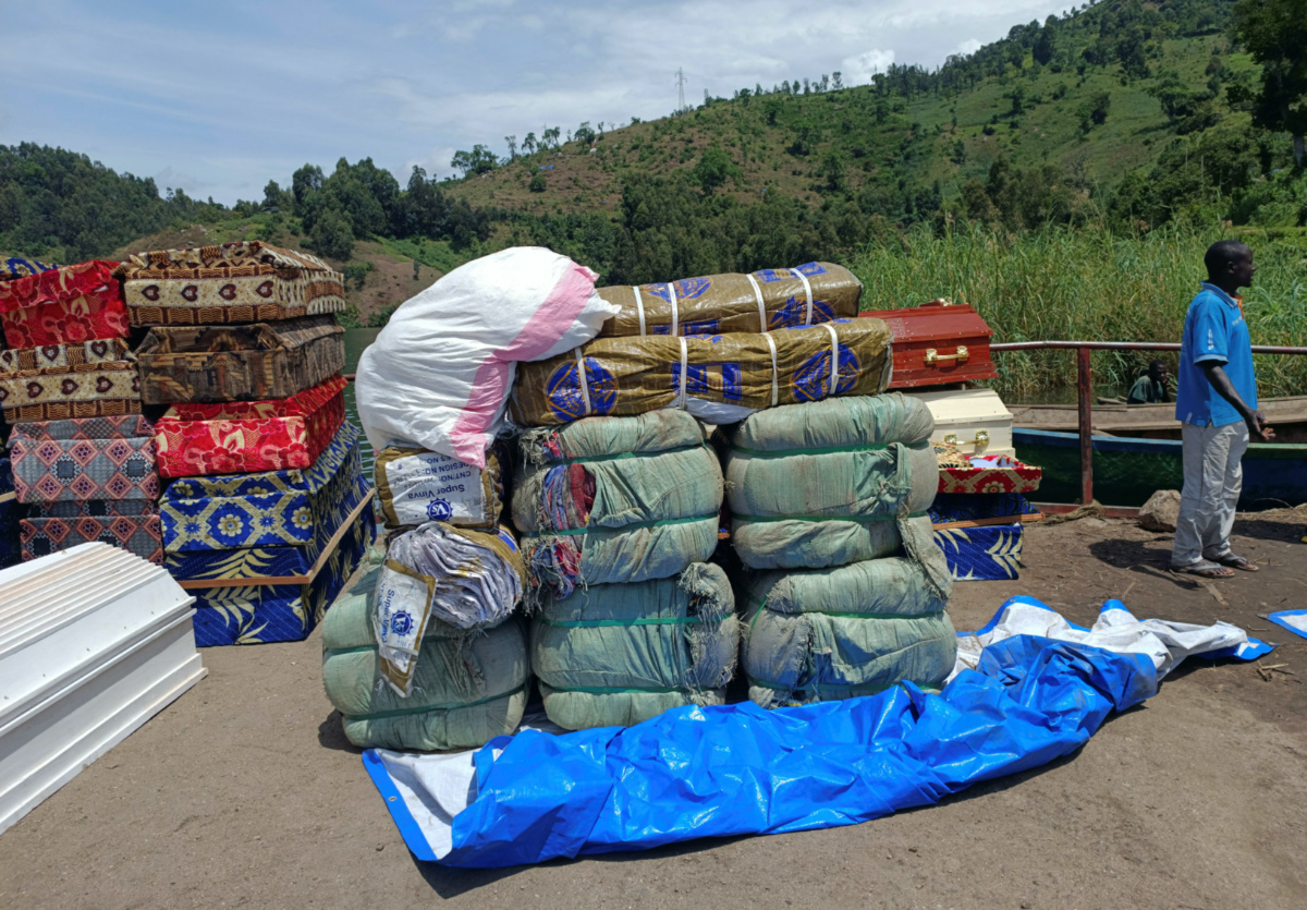 Workers arrange humanitarian relief and coffins for the Congolese civilians killed following rains that destroyed the remote, mountainous area and ripped through the riverside villages of Nyamukubi, Kalehe territory in South Kivu province of the Democratic Republic of Congo on 9th May, 2023.