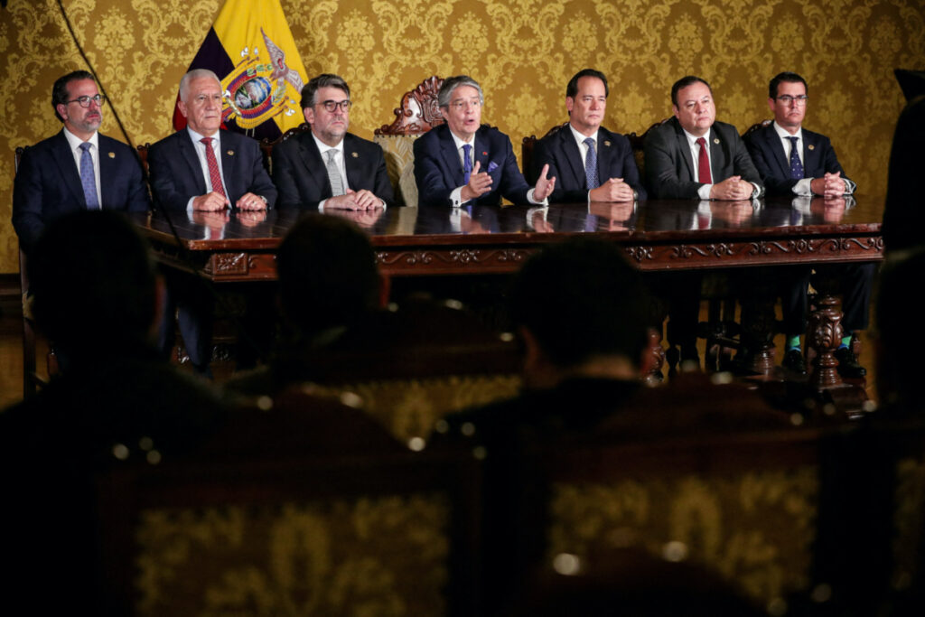 Ecuador's President Guillermo Lasso addresses the nation next to members of government, after he dissolved the National Assembly by decree, bringing forward legislative and presidential elections, a day after he defended himself in an impeachment hearing, in Quito, Ecuador, on 17th May, 2023.