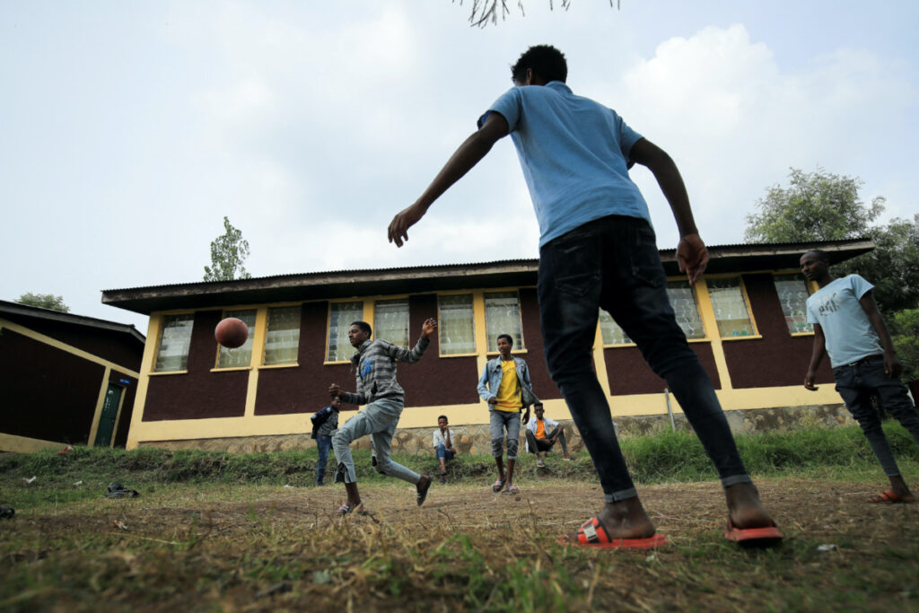 Boys play soccer at a camp for the internally displaced due to the fighting between the Ethiopian National Defense Force and the Tigray People's Liberation Front forces in Dessie town, Amhara region, Ethiopia, on 8th October, 2021.