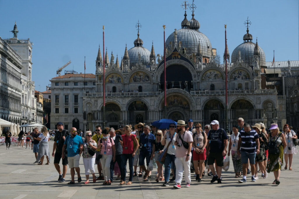 Tourists walk in St Mark's Square as the municipality prepares to charge them up to 10 euro for entry into the lagoon city, in order to cut down the number of visitors, in Venice, Italy, on 5th September, 2021.