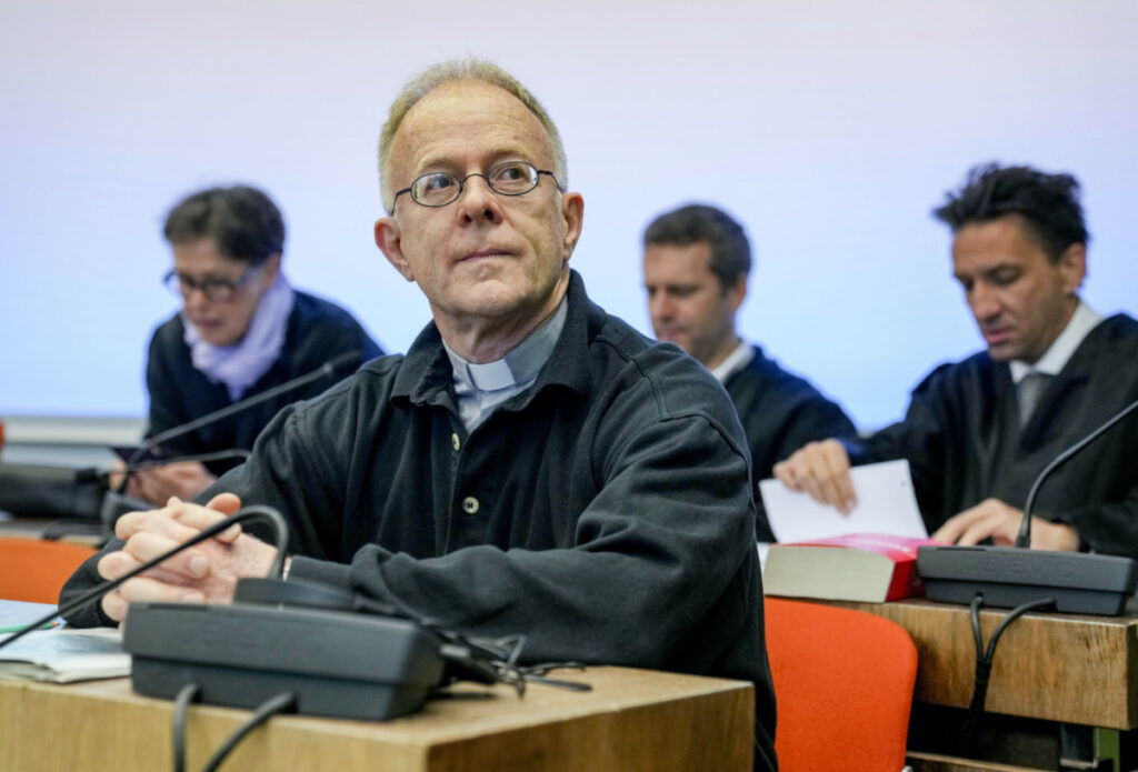 Priest Joerg Alt, front, attends the beginning of his trial at a court in Munich, Germany, on Wednesday, 3rd May, 2023.