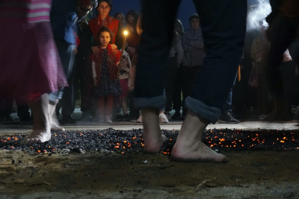 Firewalkers dance across a bed of burning coals in a ritual in honour of St Constantine in the village of Lagkadas, Greece on Monday, 22nd May, 2023.