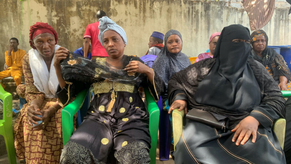 Mariame Diallo, the mother of Boubacar Diallo, 17, who was killed during the May clashes between demonstrators and security forces, gestures while she is surrounded by relatives and friends who came to support her in Conakry, Guinea, on 11th May, 2023.