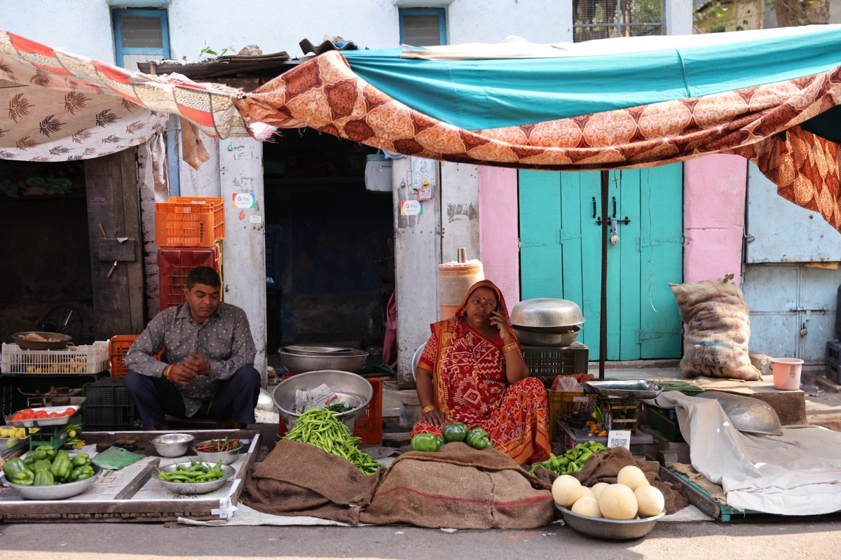 Kantaben Kishanbhai Parmar waits for customers at her roadside vegetable stall in Ahmedabad, India, on 30th April, 2023.