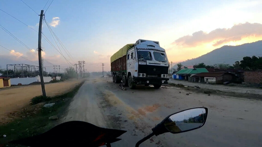 A view of a truck with its windshield broken, in Manipur, India, on 6th May, 2023, in this screengrab obtained from a social media video.