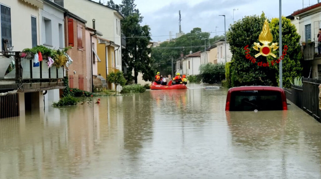 Rescuers take people to safety during rescue operations, in Forli, Italy after floods hit Italy's northern Emilia-Romagna region, in this handout image released on 17th May, 2023.