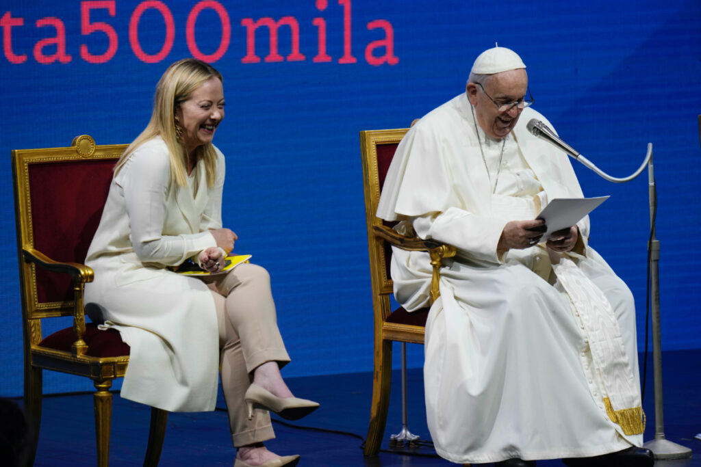 Pope Francis delivers his speech flanked by Italian Premier Giorgia Meloni during a conference on birthrate, at Auditorium della Conciliazione, in Rome, on Friday, 12th May, 2023