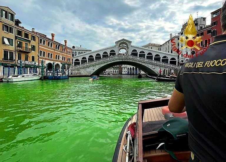 Venice's waters turn green due to an unknown substance near the Rialto Bridge, in Venice, Italy in this handout image released on 28th May, 2023.