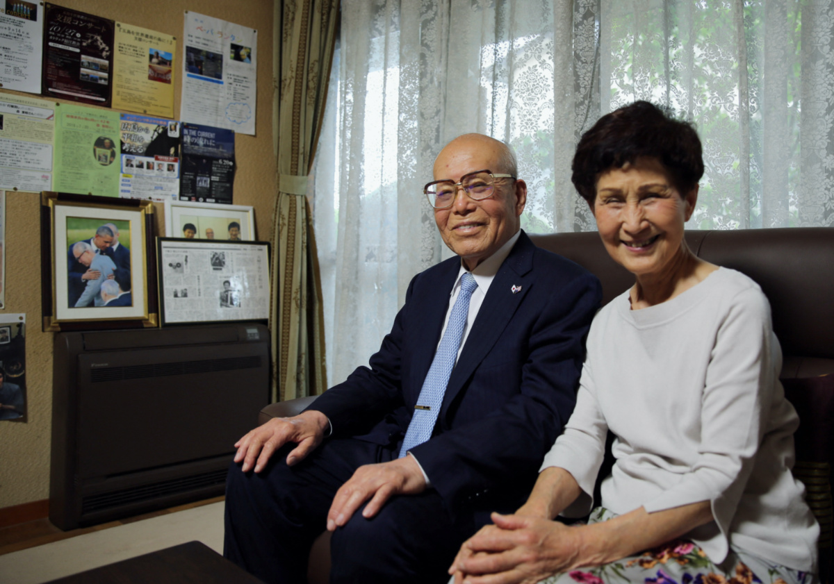 Atomic bomb survivor Shigeaki Mori and his wife Kayoko pose for a photograph during an interview with Reuters at their home in Hiroshima, western Japan, on 11th May, 2023.