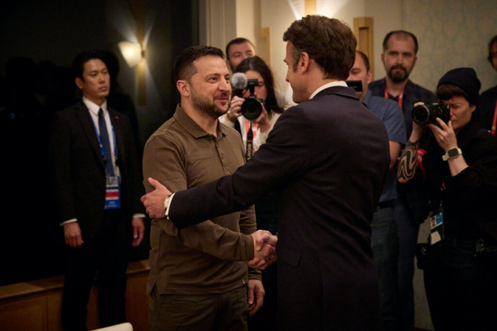 Ukraine's President Volodymyr Zelenskiy and French President Emmanuel Macron shake hands during the G7 leaders' summit in Hiroshima, Japan, on 20th May, 2023.