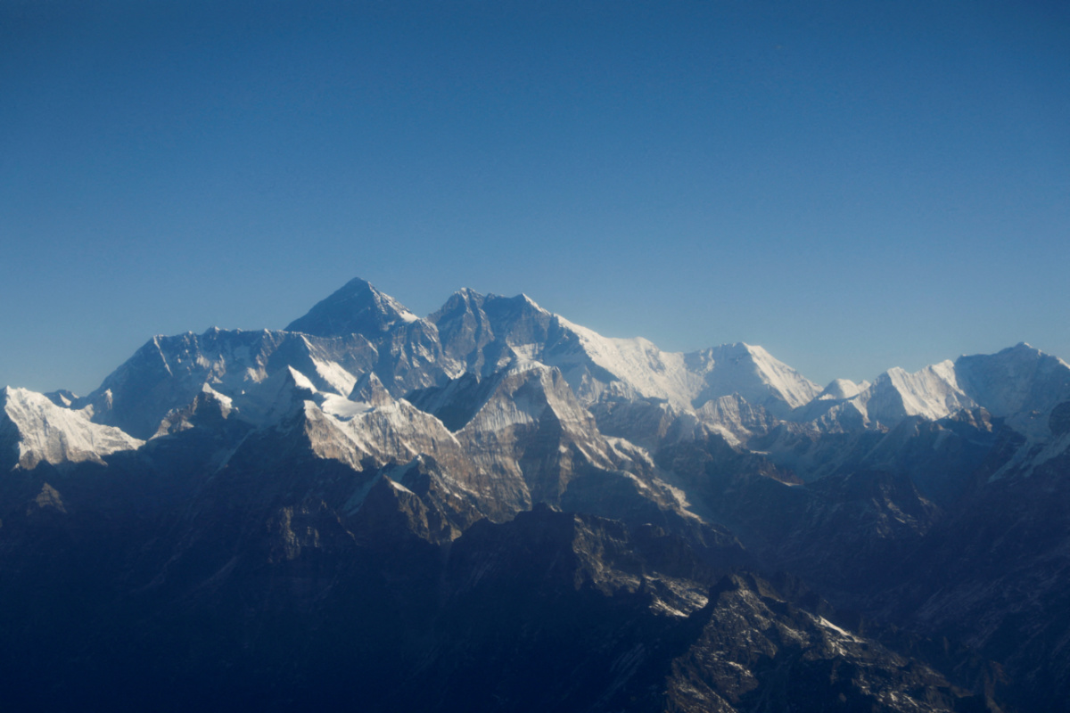 Mount Everest, the world highest peak, and other peaks of the Himalayan range are seen through an aircraft window during a mountain flight from Kathmandu, Nepal, on 15th January, 2020.