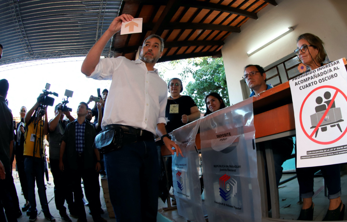 Paraguay's President Mario Abdo shows a ballot before casting his vote during Paraguay's general election, in Asuncion, Paraguay, on 30th April, 2023
