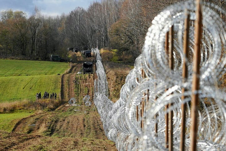 Soldiers build razor wire fence on Poland's border with Russia's exclave of Kaliningrad near Bolcie, Poland, on 3rd November, 2022.