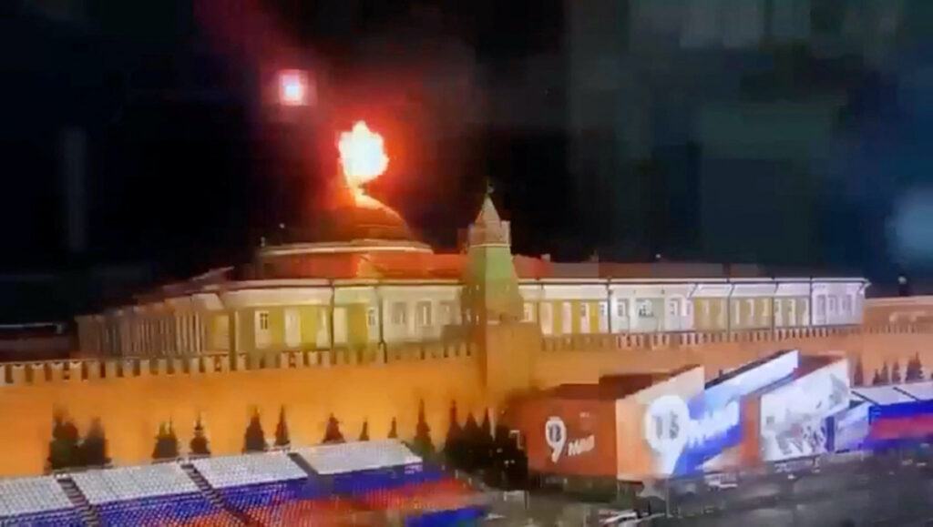 A still image taken from video shows a flying object exploding in an intense burst of light near the dome of the Kremlin Senate building during the alleged Ukrainian drone attack in Moscow, Russia, in this image taken from video obtained by Reuters on 3rd May, 2023