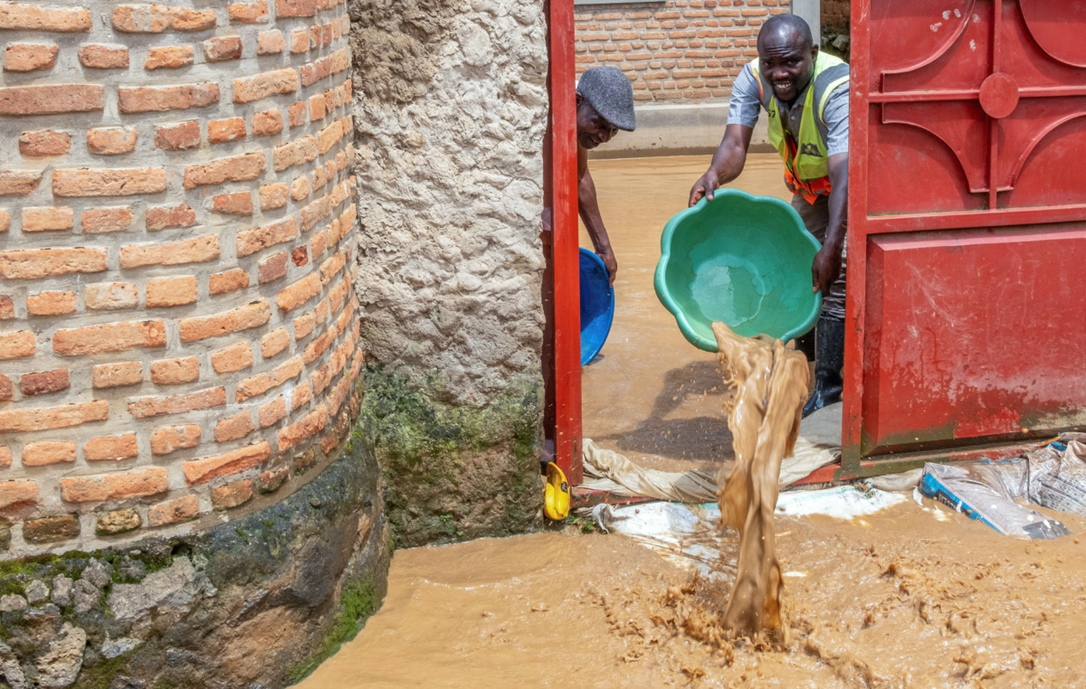 Residents drain water from their swamped home following rains that triggered flooding and landslides in Rubavu district, Western province, Rwanda, on 3rd May, 2023.