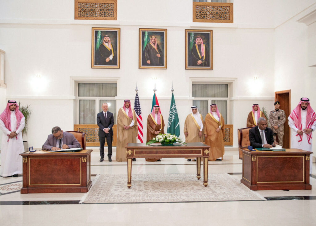 Saudi Foreign Minister Prince Faisal bin Farhan bin Abdullah Al-Saud stands along with other officials as representatives of the Sudanese army and rival paramilitary Rapid Support Forces sign an agreement for a seven-day ceasefire in Jeddah, Saudi Arabia, on 20th May, 2023.