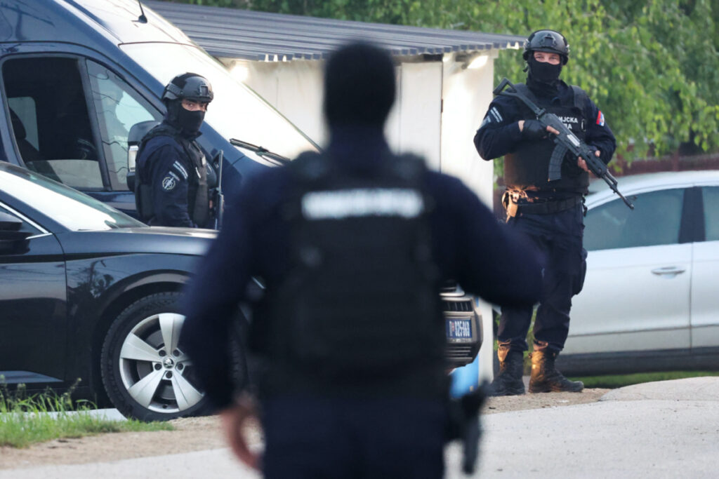 Security personnel operate, in the aftermath of a shooting, in Dubona, Serbia, on 5th May, 2023.