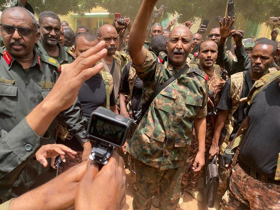 Sudan's General Abdel Fattah al-Burhan stands among troops,in an unknown location, in this picture released on 30th May, 2023.