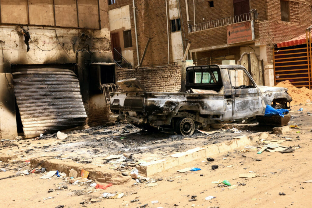 Damaged car and buildings are seen at the central market during clashes between the paramilitary Rapid Support Forces and the army in Khartoum North, Sudan, on 27th April 2023.