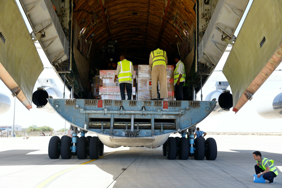 Workers unload aid from World Health Organization and UAE-AID from United Arab Emirates at the Port Sudan International Airport, Port Sudan, Sudan, on 5th May, 2023.